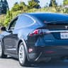 Will Tesla release FSD v15 to customer-owned vehicles?