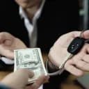 How will U.S. auto loan delinquencies be described in the next major read by March 23, 2026?