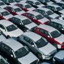 Will Trump announce a specific new tariff on Canadian-made Ford or GM trucks by April 1, 2026?