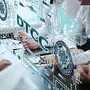 Will DTCC execute confirmed live production trades of tokenized securities in July 2026?